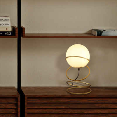 LUMÈRA gold spiral table lamp styled in luxury living room decor